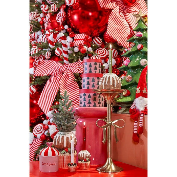 Decorative Christmas scene with a tree, presents, and festive decor.