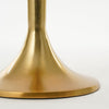 Close-up of a gold metallic object on a white background