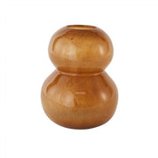 An amber-colored, organically shaped mouth-blown glass vase, with a smooth finish and no visible patterns or designs.