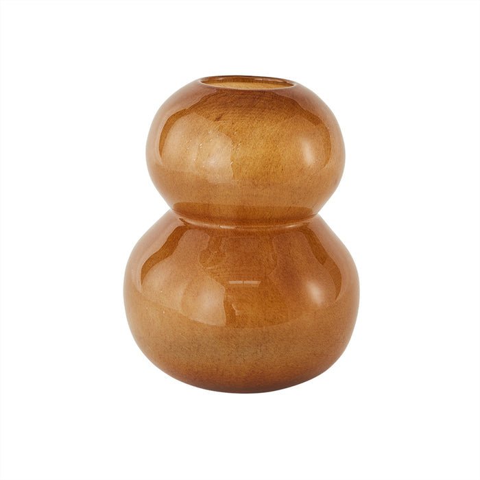 An amber-colored, organically shaped mouth-blown glass vase, with a smooth finish and no visible patterns or designs.