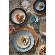 Dinnerware set on a patterned tile surface
