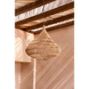 Woven pendant light hanging from a wooden ceiling