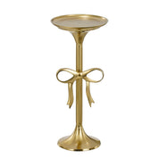 Gold side table with decorative bow design on a white background
