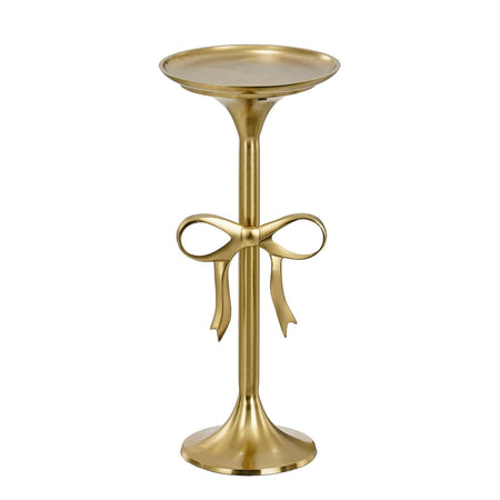 Gold side table with decorative bow design on a white background