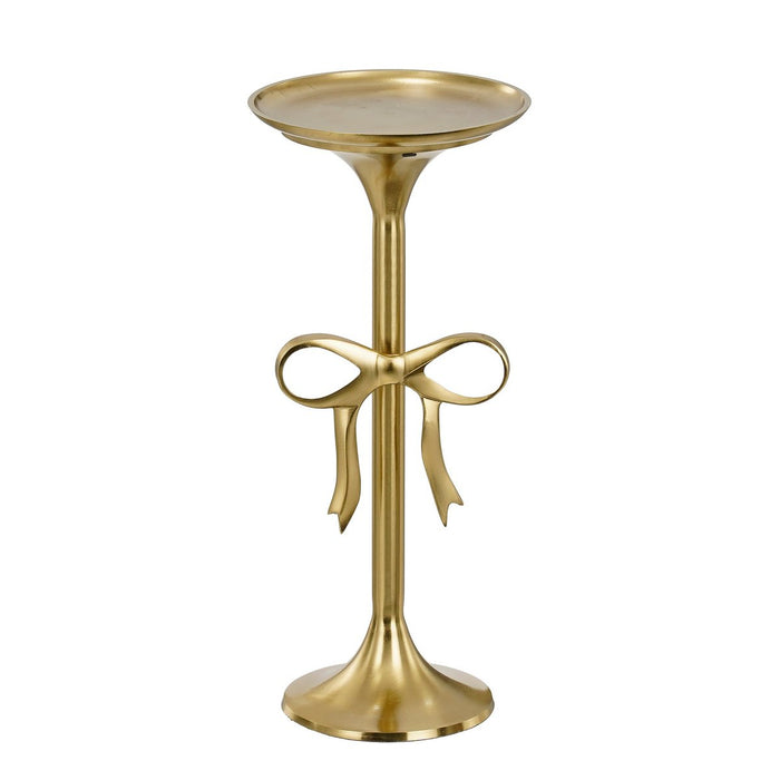 Gold side table with decorative bow design on a white background