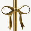 Gold bow-shaped object on a white background